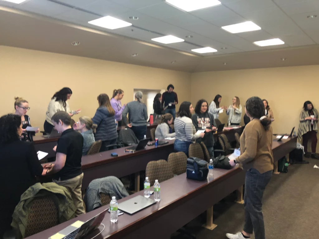 Teachers talking to each other during a session