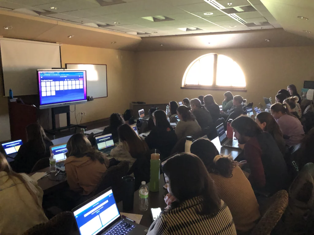 Image of teachers working on computers during a PD session with Short Answer
