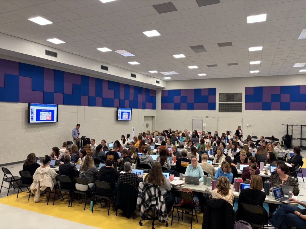 Educators in a gym taking part in a workshop
